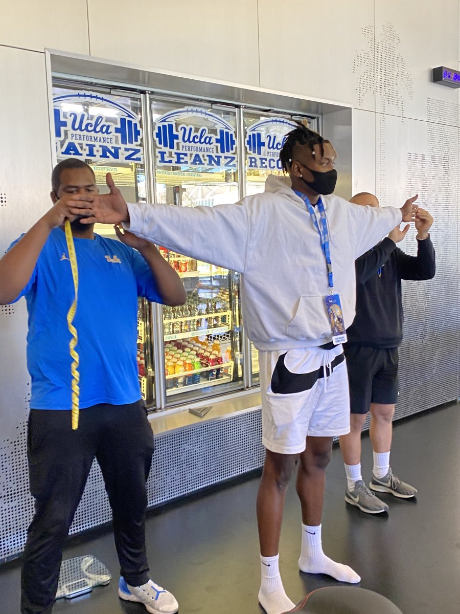 The Bruins measure Collins Acheampong's wing span.