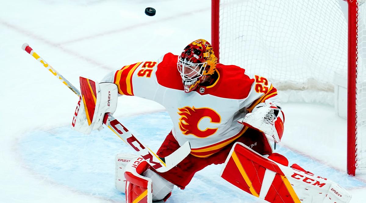 Calgary Flames goaltender Jacob Markstrom makes a save against the Arizona Coyotes during the first period of an NHL hockey game Wednesday, Feb. 2, 2022, in Glendale, Ariz. The Flames won 4-2.