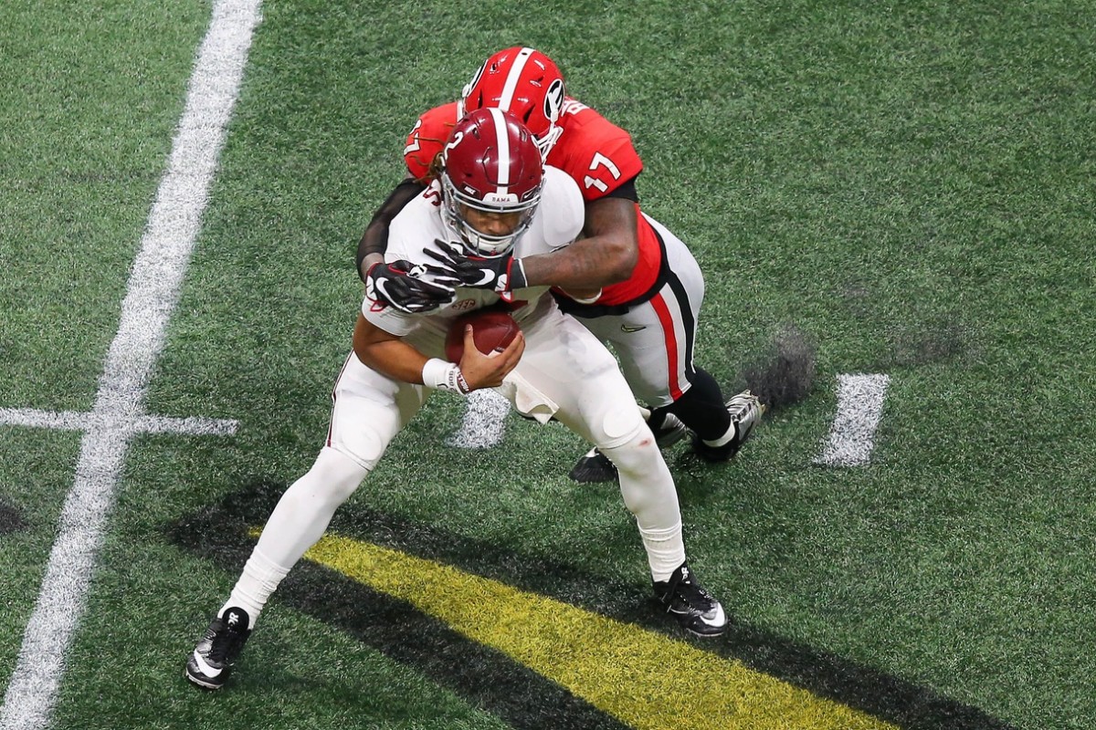 Jan 8, 2018; Alabama quarterback Jalen Hurts (2) is sacked by Georgia Bulldogs linebacker Davin Bellamy (17) during the 2018 CFP national championship game . Mandatory Credit: Butch Dill-USA TODAY Sports