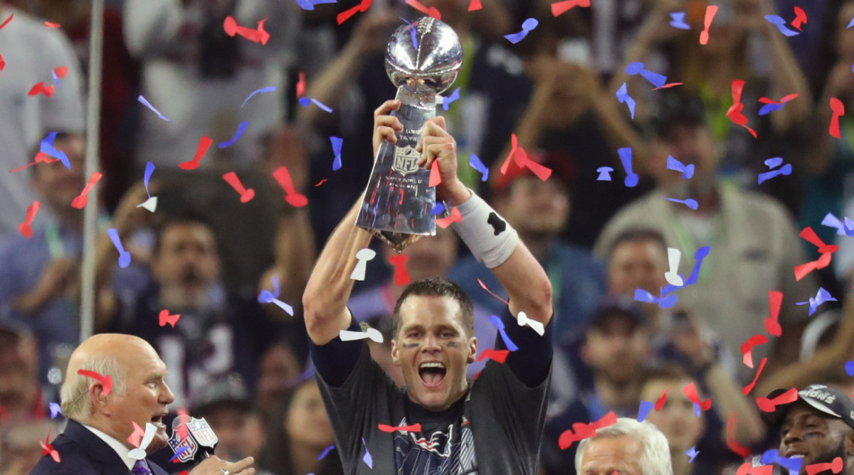 New England Patriots quarterback Tom Brady (12) celebrates with the Vince Lombardi Trophy after winning Super Bowl LI against the Atlanta Falcons at NRG Stadium.