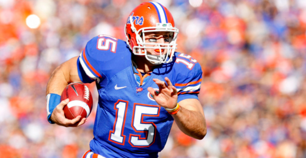 Florida Gators quarterback Tim Tebow on a rushing attempt during a college football game in the SEC.