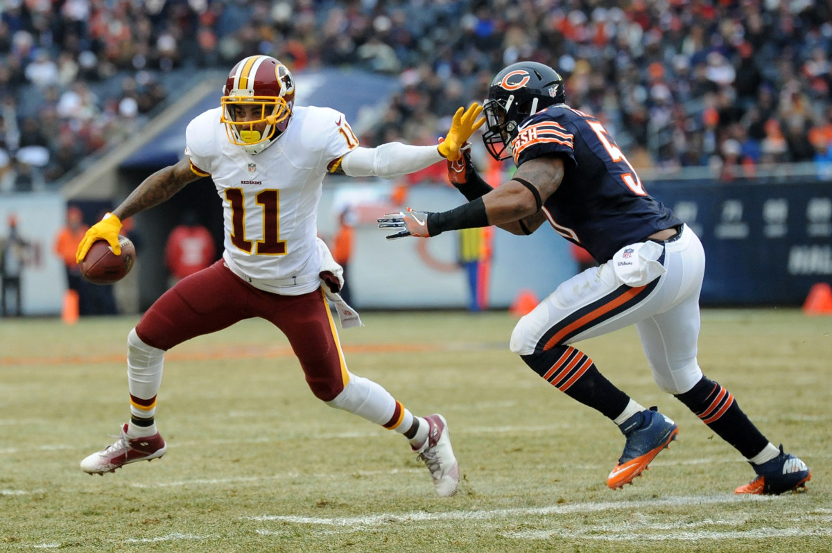 Dec 24, 2016; Chicago, IL, USA; Washington Redskins wide receiver DeSean Jackson (11) carries the ball as Chicago Bears inside linebacker Jerrell Freeman (50) defends during the first half at Soldier Field. Mandatory Credit: Patrick Gorski-USA TODAY Sports