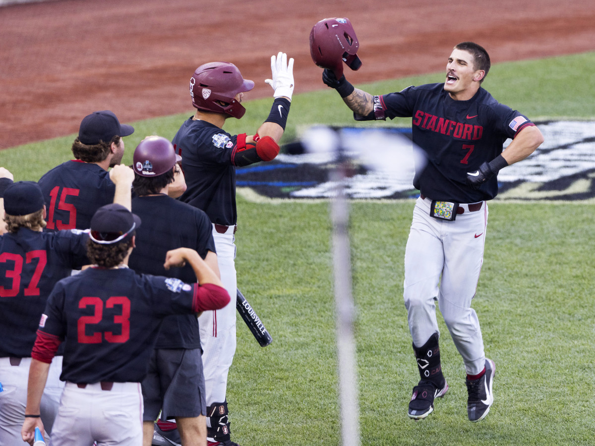 Stanford's Brock Jones (7), right, celebrates with teammates after hitting a home run against Vanderbilt in the third inning during a baseball game in the College World Series Wednesday, June 23, 2021, at TD Ameritrade Park in Omaha, Neb. The college baseball season opens Friday, Feb. 18, 2022.