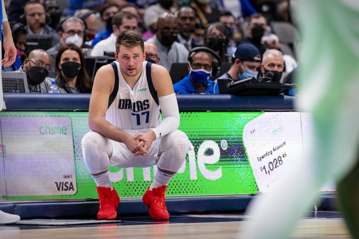 Luka Doncic crouching red shoes