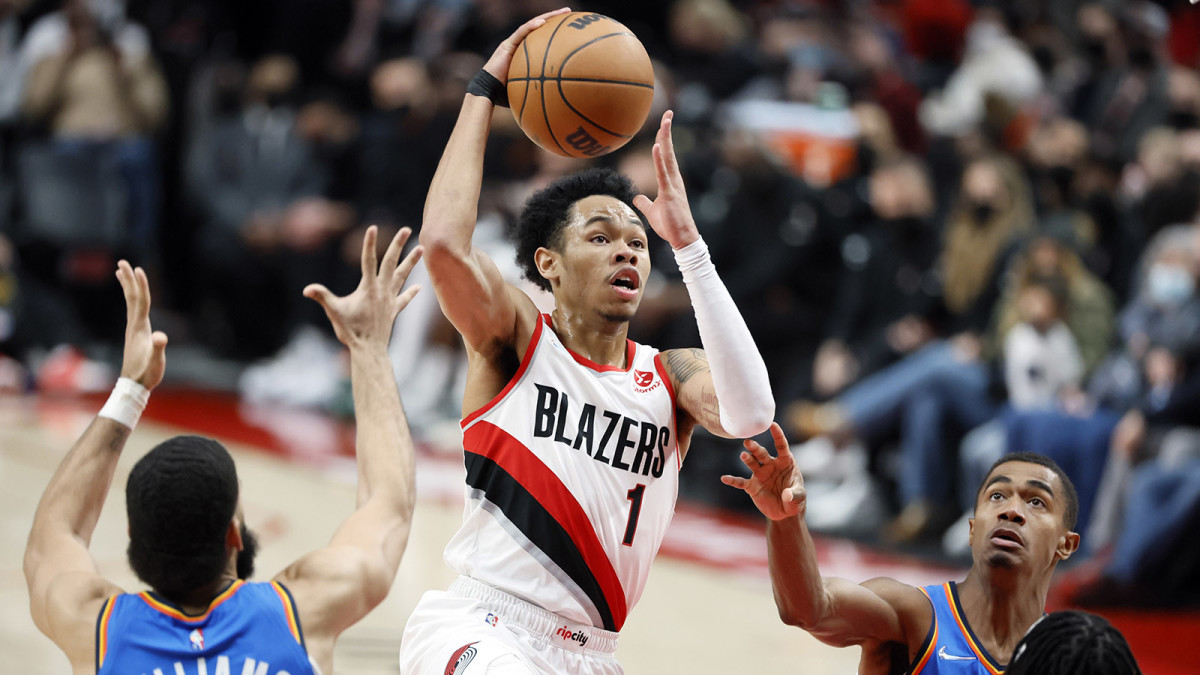 Portland Trail Blazers shooting guard Anfernee Simons (1) drives for the basket between Oklahoma City Thunder small forward Kenrich Williams.