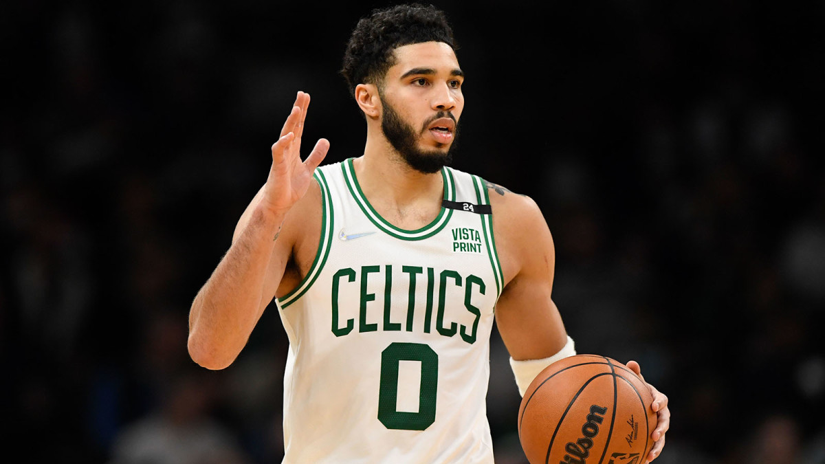 Boston Celtics forward Jayson Tatum (0) dribbles the ball during the second half of a game against the Detroit Pistons.