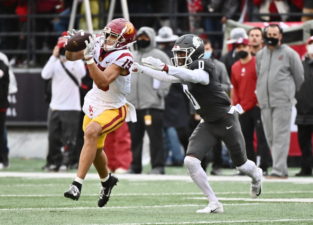 Sep 18, 2021; Pullman, Washington, USA; USC Trojans wide receiver Drake London (15) makes a catch in front of Washington State Cougars defensive back Jaylen Watson (0) in the second half at Gesa Field at Martin Stadium. The Trojans won 45-14. Mandatory Credit: James Snook-USA TODAY Sports