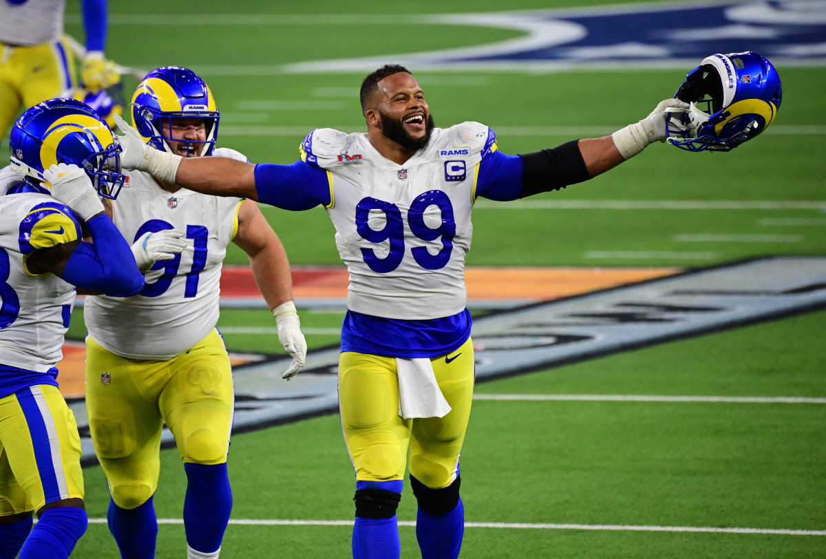 Feb 13, 2022; Inglewood, California, USA; Los Angeles Rams defensive tackle Aaron Donald (99) celebrates after a pressure in the fourth quarter against the Cincinnati Bengals in Super Bowl LVI at SoFi Stadium. Mandatory Credit: Gary A. Vasquez-USA TODAY Sports