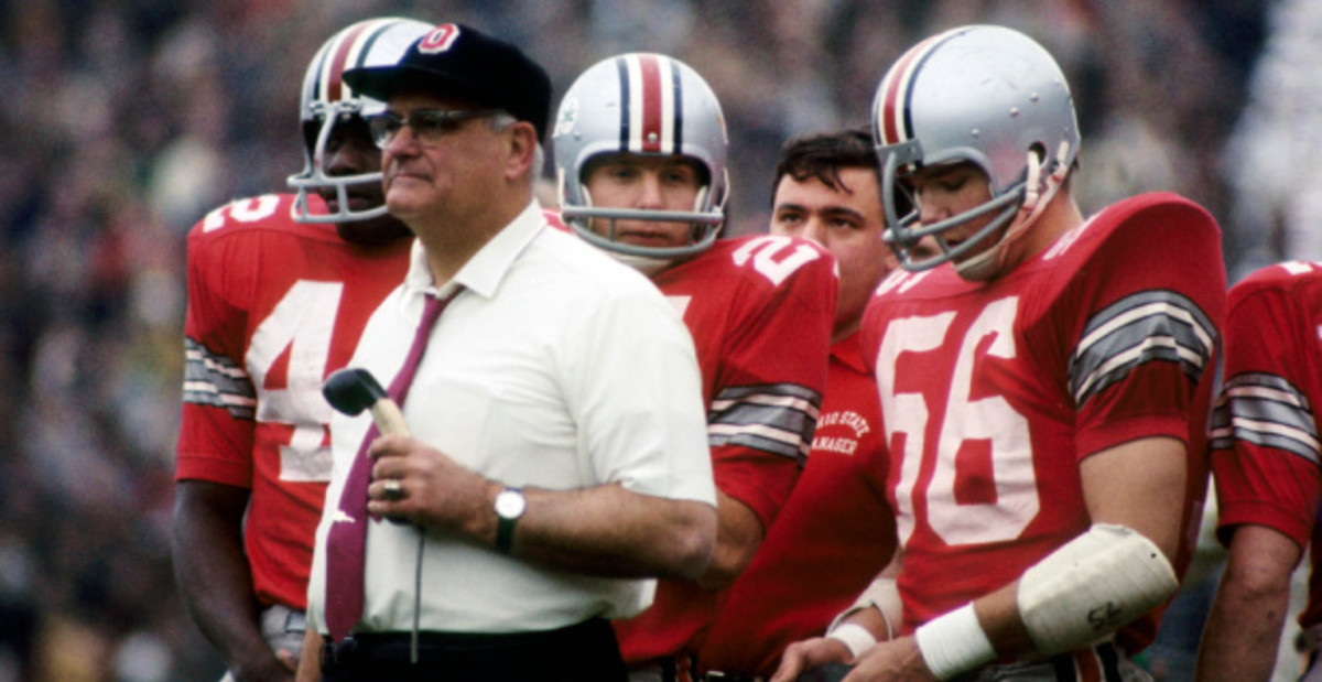 Ohio State Buckeyes head coach Woody Hayes coaching from the sideline during a college football game in the Big Ten.