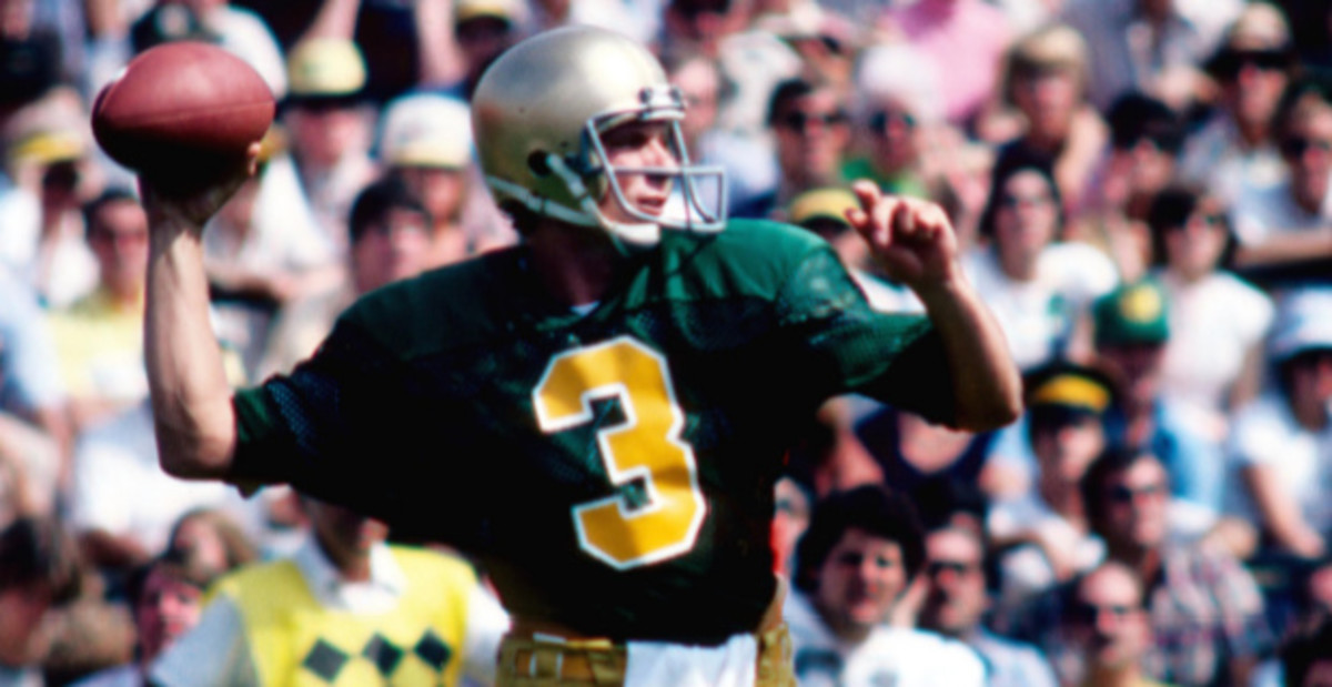 Notre Dame Fighting Irish quarterback Joe Montana attempts a pass during a college football game.