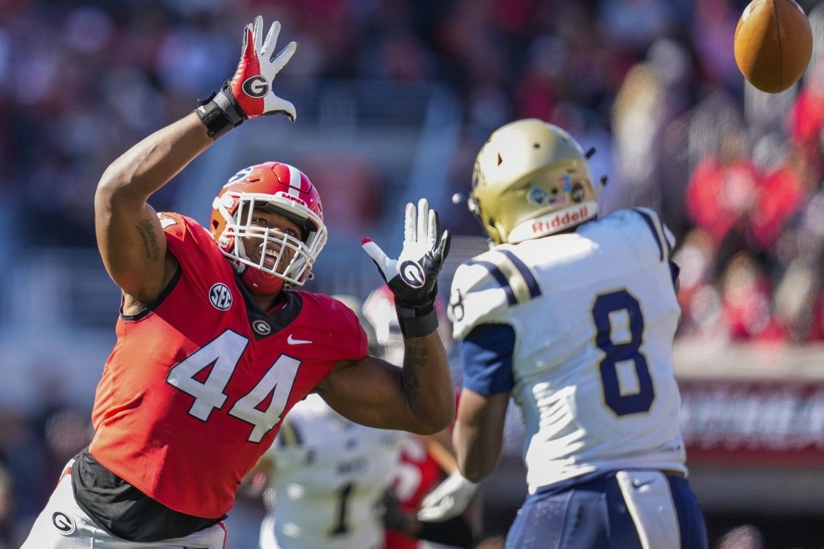 Georgia Bulldogs defensive lineman Travon Walker (44) rushes Charleston Southern Buccaneers quarterback Jack Chambers (8) during the first half at Sanford Stadium.