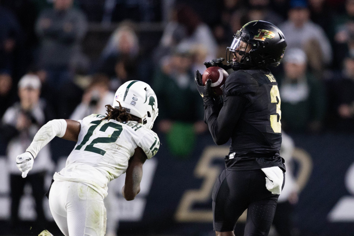 Nov 6, 2021; West Lafayette, Indiana, USA; Purdue Boilermakers wide receiver David Bell (3) catches the ball while Michigan State Spartans cornerback Chester Kimbrough (12) defends in the second half at Ross-Ade Stadium. Mandatory Credit: Trevor Ruszkowski-USA TODAY Sports
