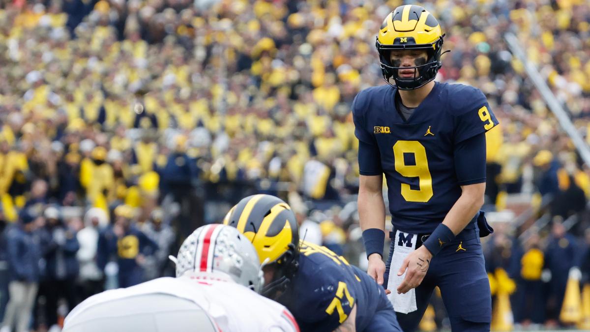 Michigan Wolverines quarterback J.J. McCarthy lines up to take a snap against the Ohio State Buckeyes at Michigan Stadium in Ann Arbor. 