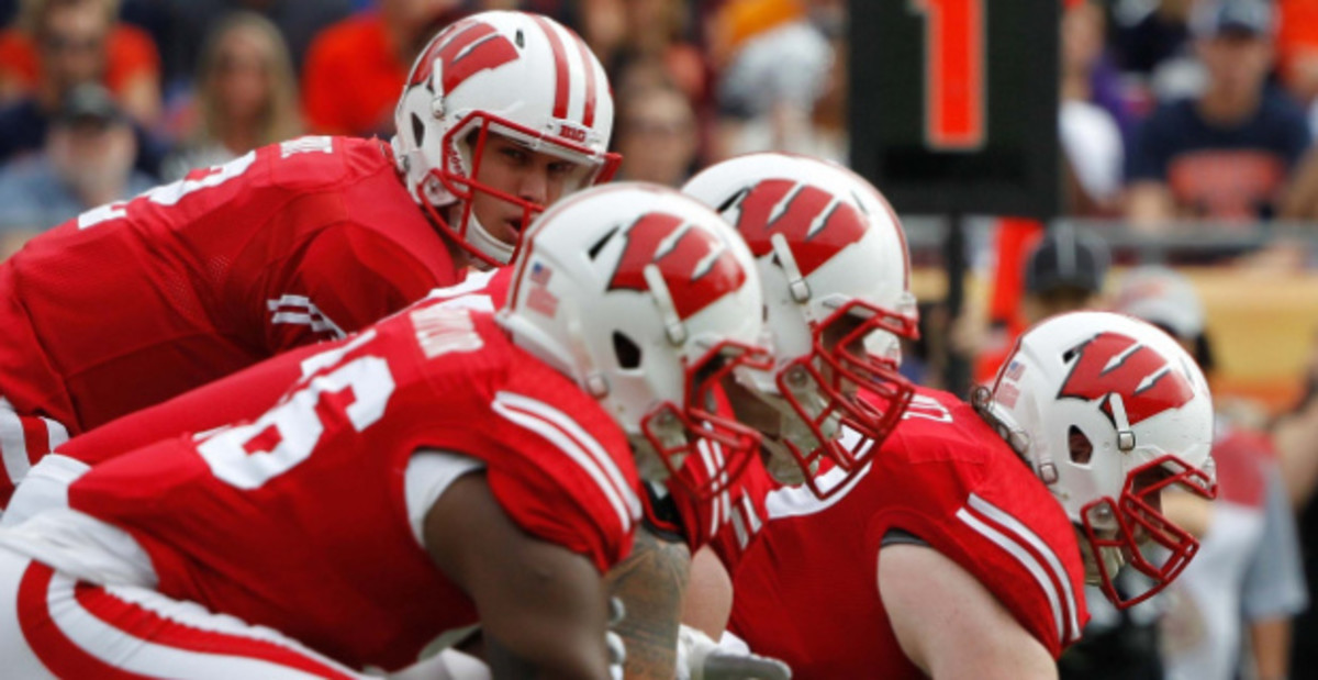 Scenes at the line of scrimmage during a Wisconsin Badgers game during a college football game in the Big Ten.