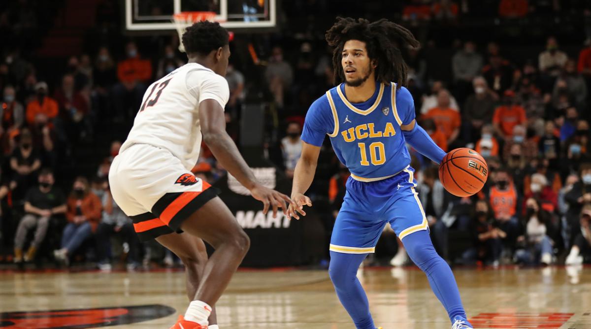 Oregon State guard Dashawn Davis (13) guards against UCLA guard Tyger Campbell (10) during the second half of an NCAA college basketball game on Saturday, Feb. 26, 2022, in Corvallis, Ore. UCLA won 94-55.