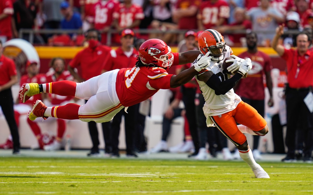 Sep 12, 2021; Kansas City, Missouri, USA; Cleveland Browns wide receiver Jarvis Landry (80) is tackled by Kansas City Chiefs nose tackle Derrick Nnadi (91) during the first half at GEHA Field at Arrowhead Stadium. Mandatory Credit: Jay Biggerstaff-USA TODAY Sports