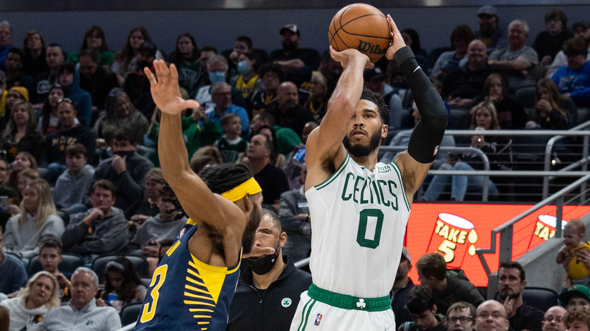 Boston Celtics forward Jayson Tatum (0) shoots the ball