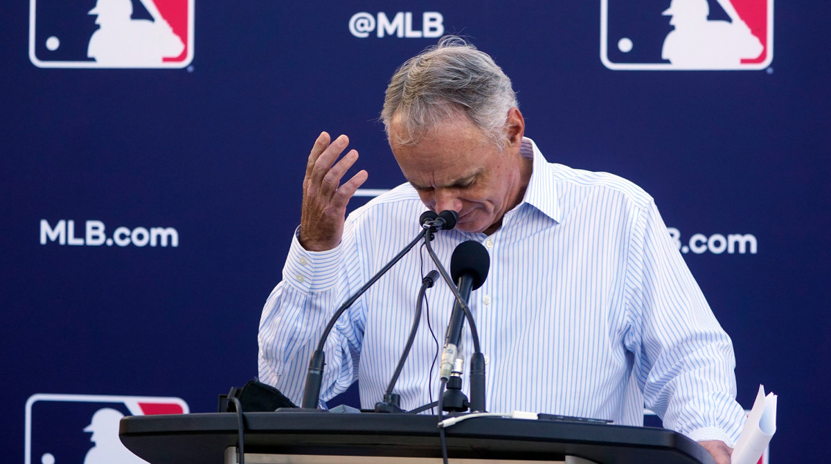 Major League Baseball Commissioner Rob Manfred gestures as he answers questions during a news conference after negotiations with the players' association toward a labor deal, Tuesday, March 1, 2022, at Roger Dean Stadium in Jupiter, Fla.