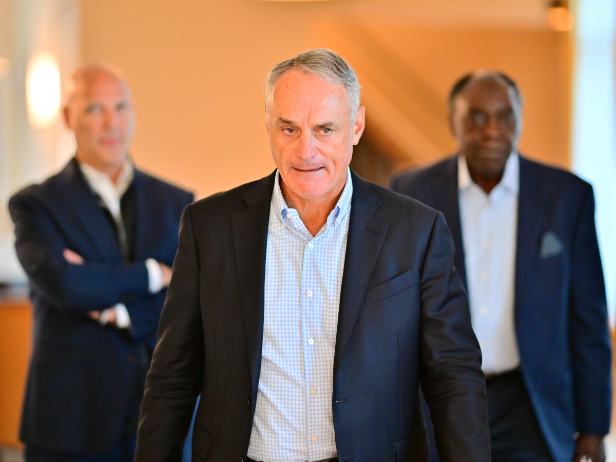 Major League Baseball Commissioner Rob Manfred walks to a press conference during an MLB owner's meeting at the Waldorf Astoria on February 10, 2022 in Orlando, Florida. Manfred addressed the ongoing lockout of players, which owners put in place after the league's collective bargaining agreement ended on December 1, 2021.