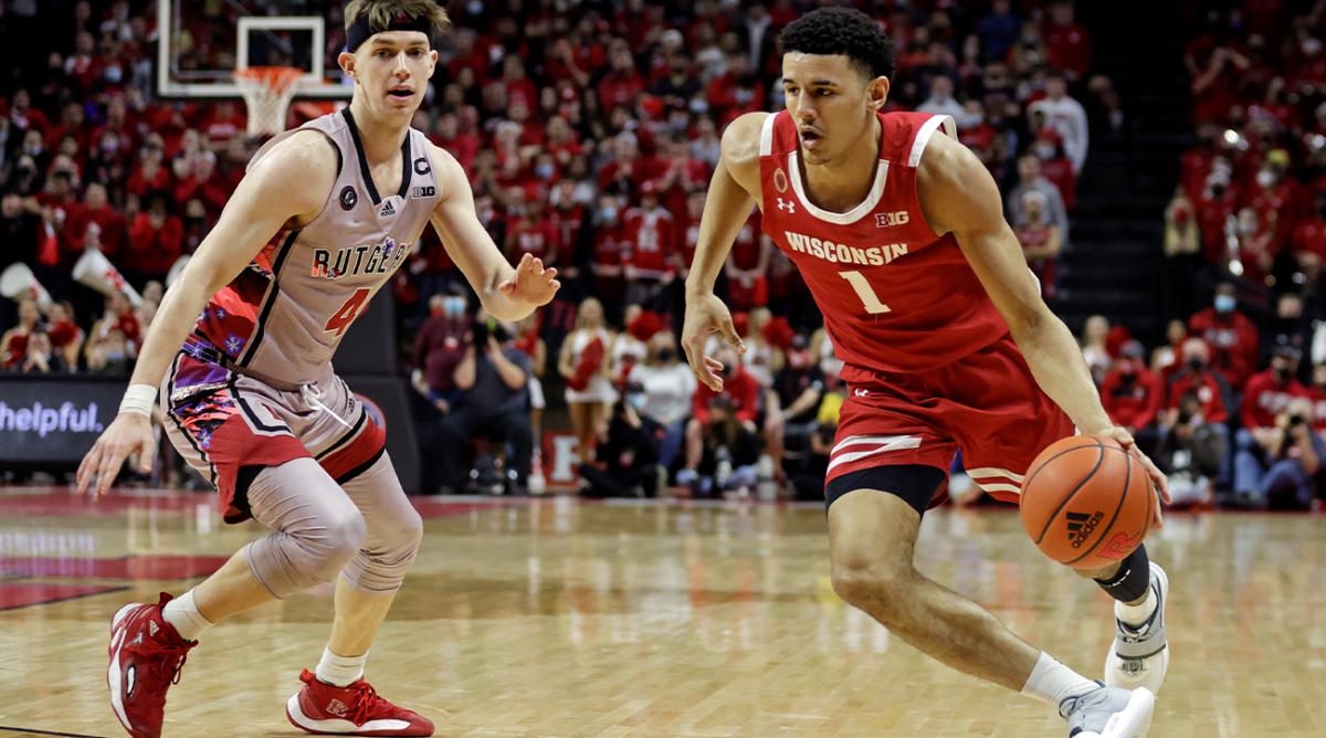 Wisconsin guard Johnny Davis (1) drives past Rutgers guard Paul Mulcahy during the first half of an NCAA college basketball game Saturday, Feb. 26, 2022, in Piscataway, N.J.
