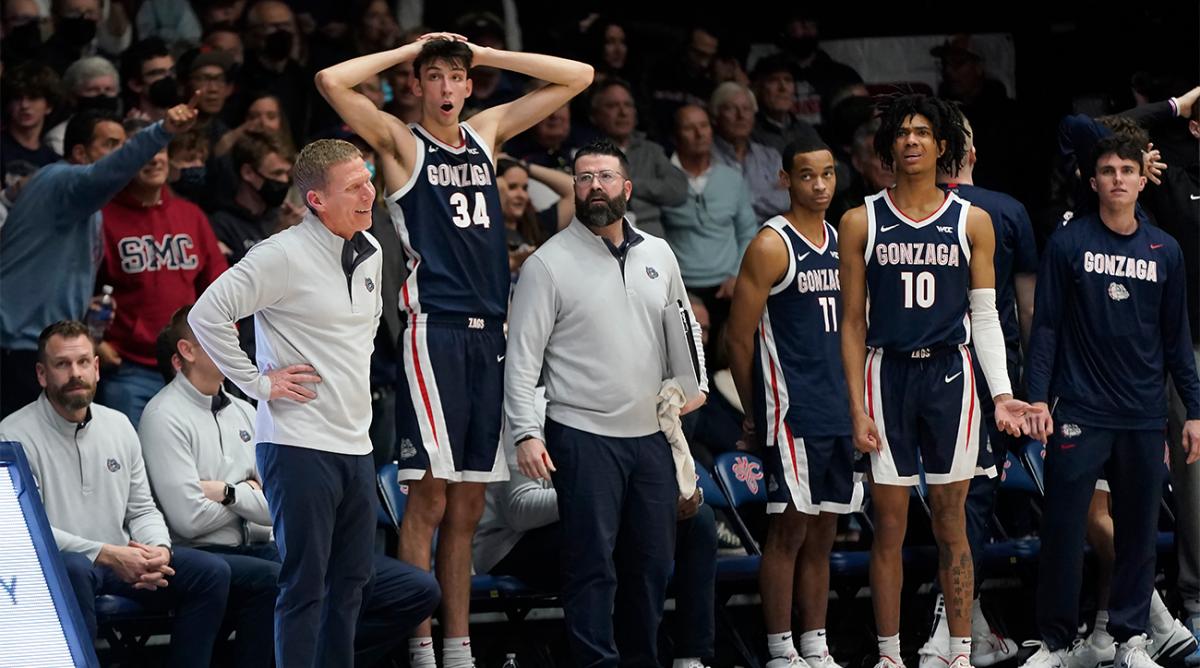 Gonzaga coach Mark Few, standing at left, reacts to a call with Chet Holmgren (34), Nolan Hickman (11) and Hunter Sallis (10) during the second half of the team's NCAA college basketball game against Saint Mary's in Moraga, Calif., Saturday, Feb. 26, 2022.