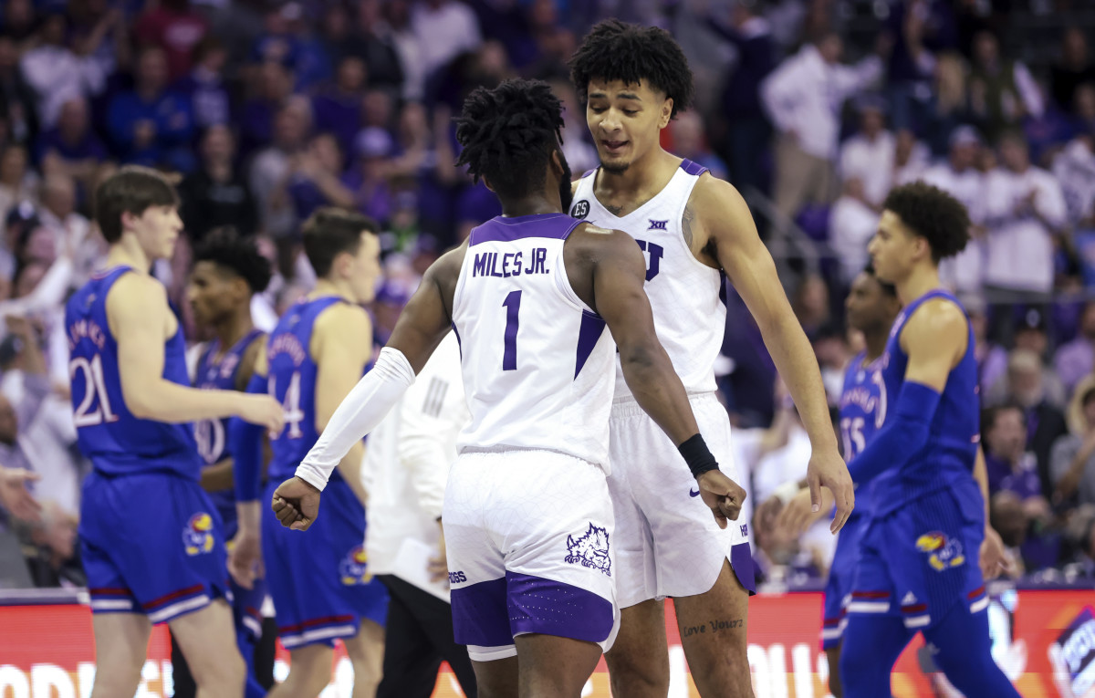 Mar 1, 2022; Fort Worth, Texas, USA; TCU Horned Frogs guard Mike Miles (1) and TCU Horned Frogs guard Micah Peavy (0) celebrate during the second half against the Kansas Jayhawks at Ed and Rae Schollmaier Arena. Mandatory Credit: Kevin Jairaj-USA TODAY Sports