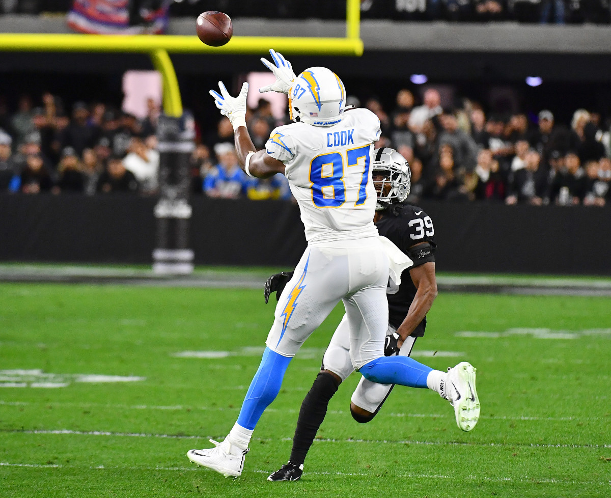 Jan 9, 2022; Paradise, Nevada, USA; Los Angeles Chargers tight end Jared Cook (87) makes a catch against Las Vegas Raiders cornerback Nate Hobbs (39) at Allegiant Stadium. Mandatory Credit: Stephen R. Sylvanie-USA TODAY Sports