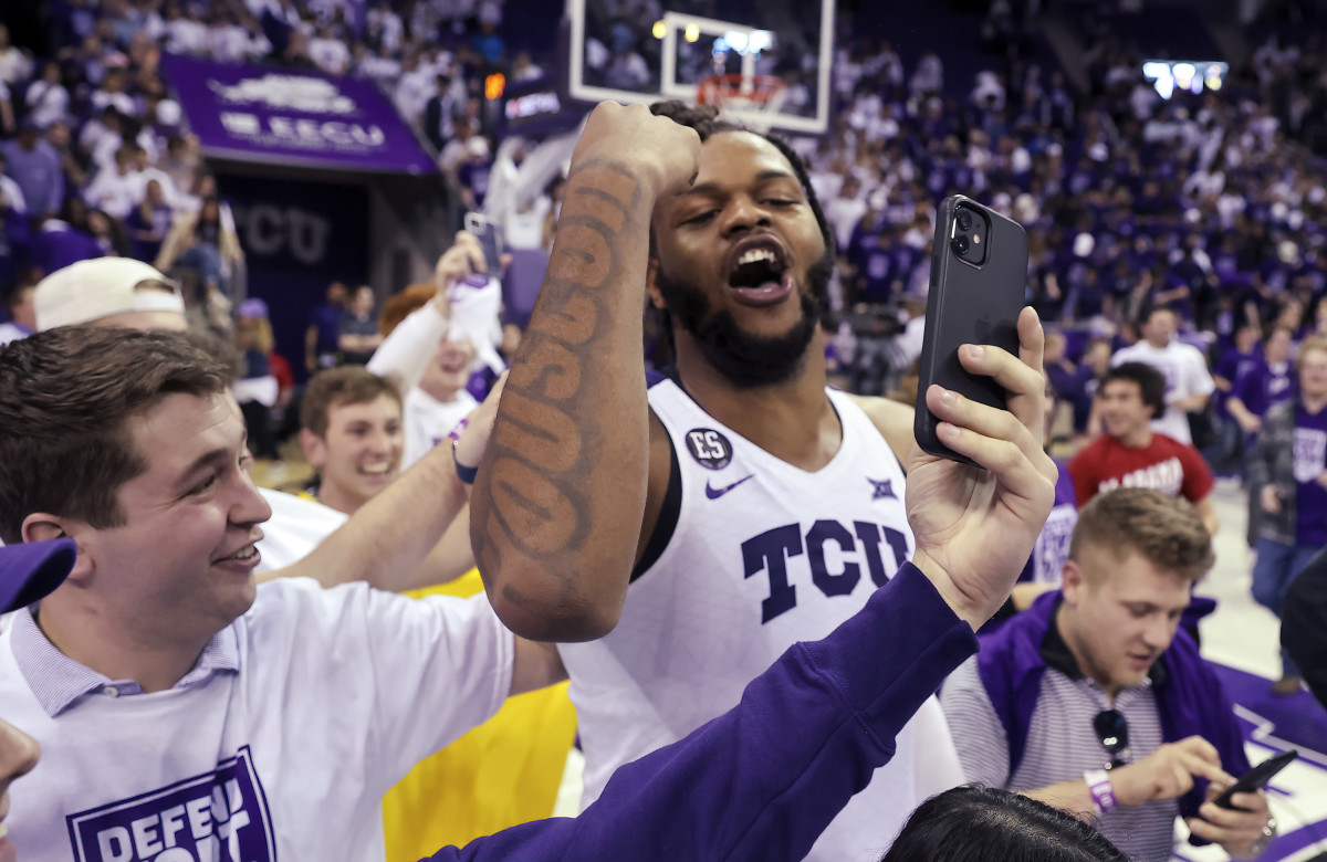 Mar 1, 2022; Fort Worth, Texas, USA; TCU Horned Frogs center Eddie Lampkin (4) celebrates with fans after the game against the Kansas Jayhawks at Ed and Rae Schollmaier Arena. Mandatory Credit: Kevin Jairaj-USA TODAY Sports
