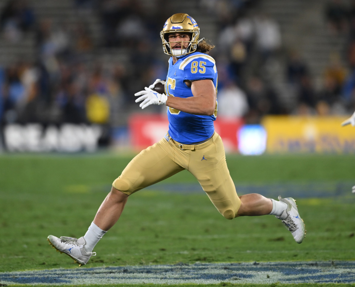 Nov 27, 2021; Pasadena, California, USA; UCLA Bruins tight end Greg Dulcich (85) completes a pass play for a first down in the first half of the game against the California Golden Bears at the Rose Bowl. Mandatory Credit: Jayne Kamin-Oncea-USA TODAY Sports