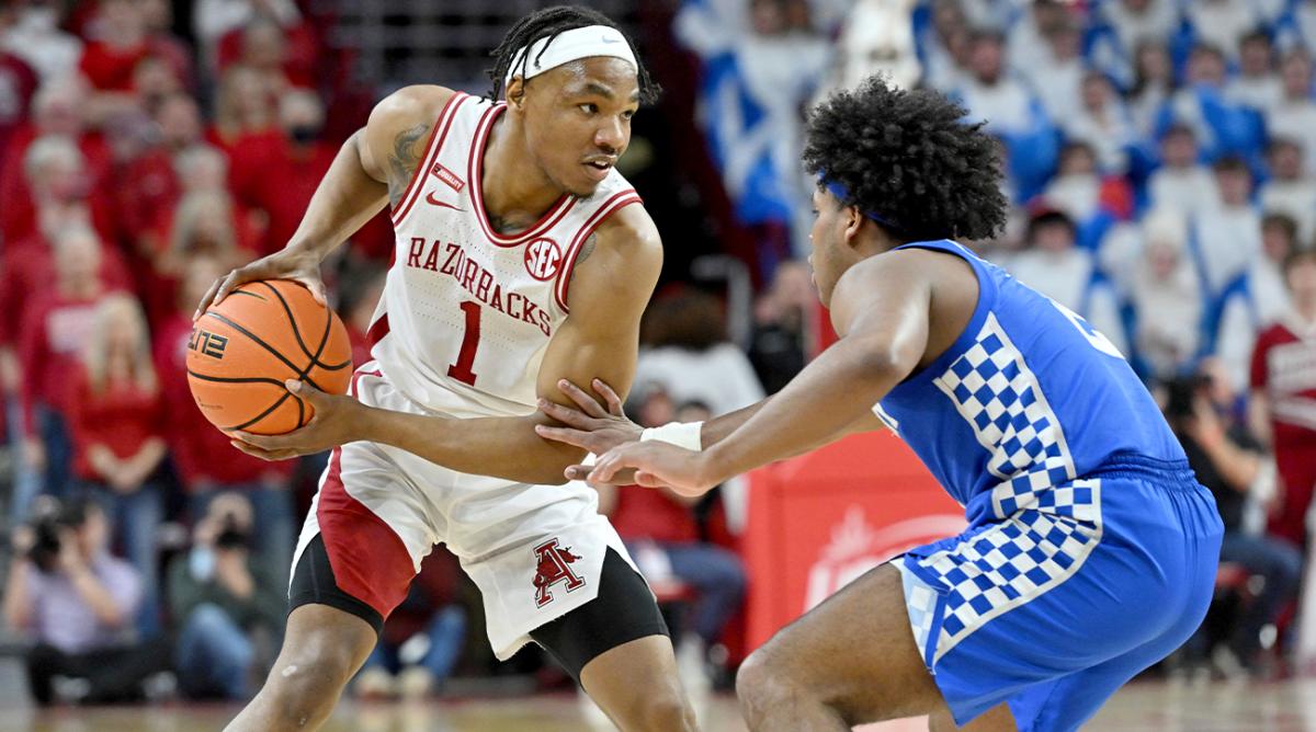 Arkansas guard JD Notae (1) tries to get past Kentucky guard Sahvir Wheeler (2) during the first half of an NCAA college basketball game Saturday, Feb. 26, 2022, in Fayetteville, Ark.