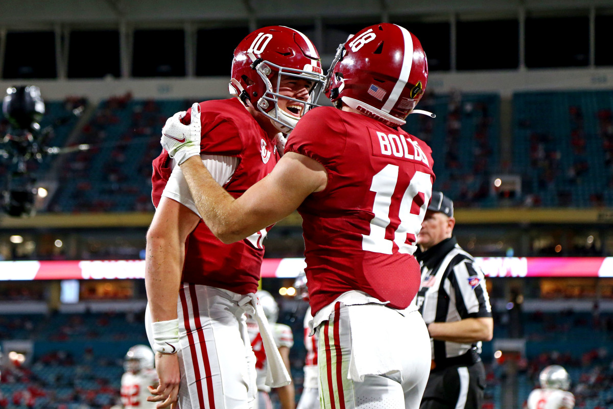 Alabama Crimson Tide wide receiver Slade Bolden (18) celebrates with quarterback Mac Jones (10) after scoring a touchdown during the third quarter against the Ohio State Buckeyes in the 2021 College Football Playoff National Championship Game.