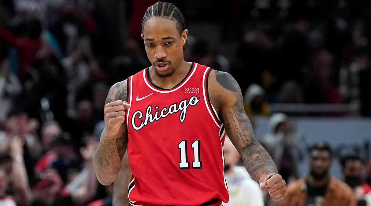 Chicago Bulls' DeMar DeRozan pumps his fist after sinking a clutch 3-point basket during the second half of an NBA basketball game against the Memphis Grizzlies, Saturday, Feb. 26, 2022, in Chicago.
