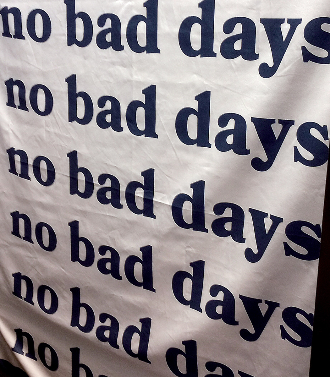 A banner hangs in a teacher cubicle to remind the teacher to not have bad days.