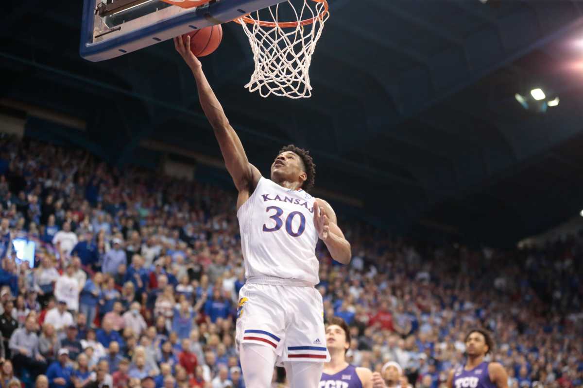 Kansas senior guard Ochai Agbaji (30) lays in for two against TCU during the first half of Thursday's game inside Allen Fieldhouse.