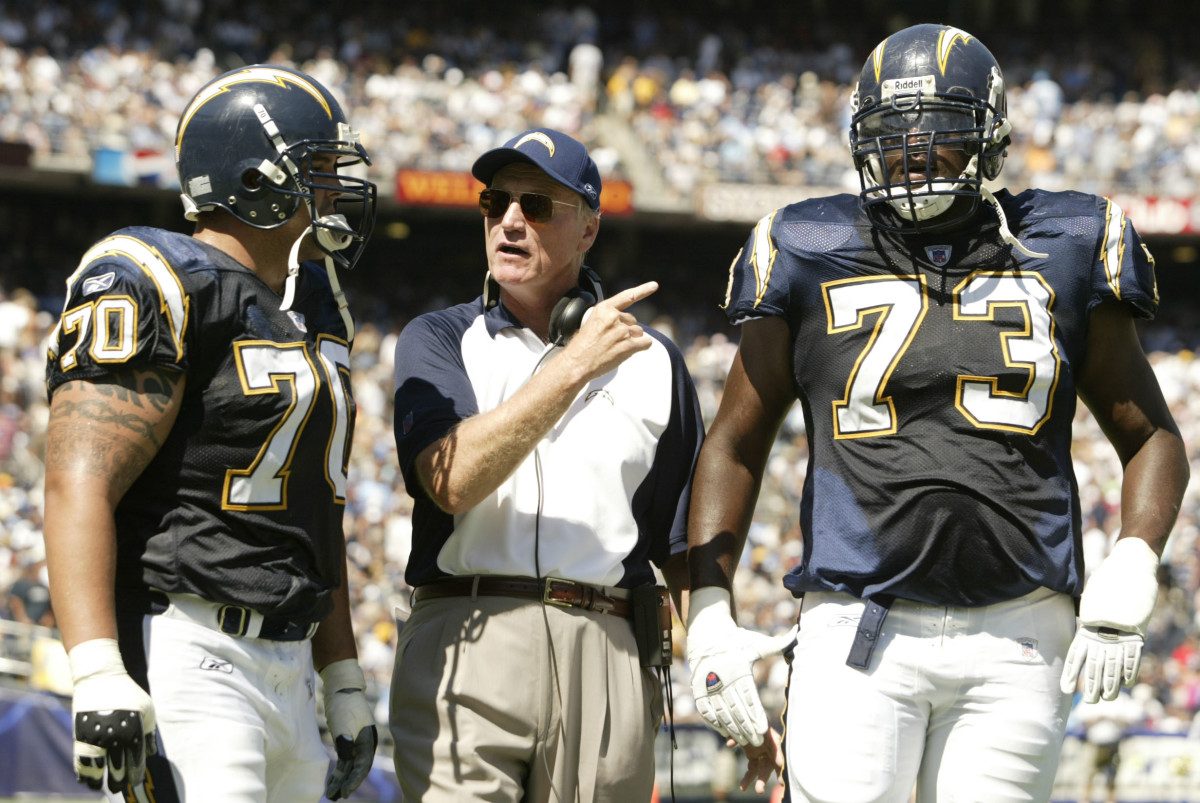 Sept 17, 2006; San Diego, CA, USA; San Diego Chargers head coach Marty Schottenheimer talks with tackles (70) Shane Olivea and (73) Marcus McNeill during the 1st half against the Tennessee Titans at Qualcomm Stadium. Mandatory Credit: Photo By Stan Liu-USA TODAY Sports Copyright © 2006 Stan Liu