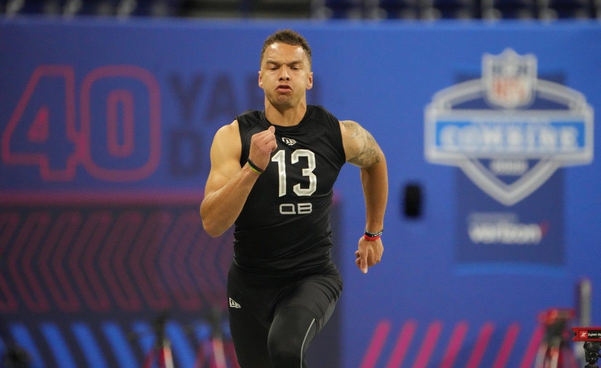 Cincinnati quarterback Desmond Ridder (QB13) runs the 40-yard dash during the 2022 NFL Scouting Combine at Lucas Oil Stadium.