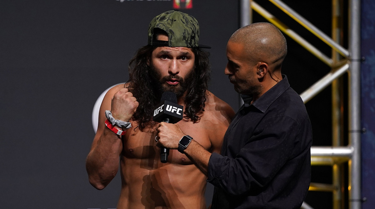 Jorge Masvidal (left) talks with UFC play-by-play commentator Jon Anik during weigh-ins for UFC 261 at VyStar Veterans Memorial Arena.