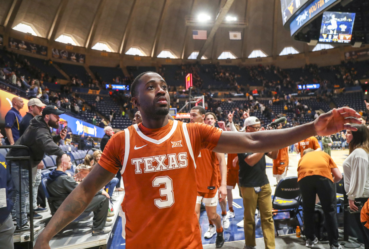 Feb 26, 2022; Morgantown, West Virginia, USA; Texas Longhorns guard Courtney Ramey (3) celebrates with fans after defeating the West Virginia Mountaineers at WVU Coliseum. Mandatory Credit: Ben Queen-USA TODAY Sports