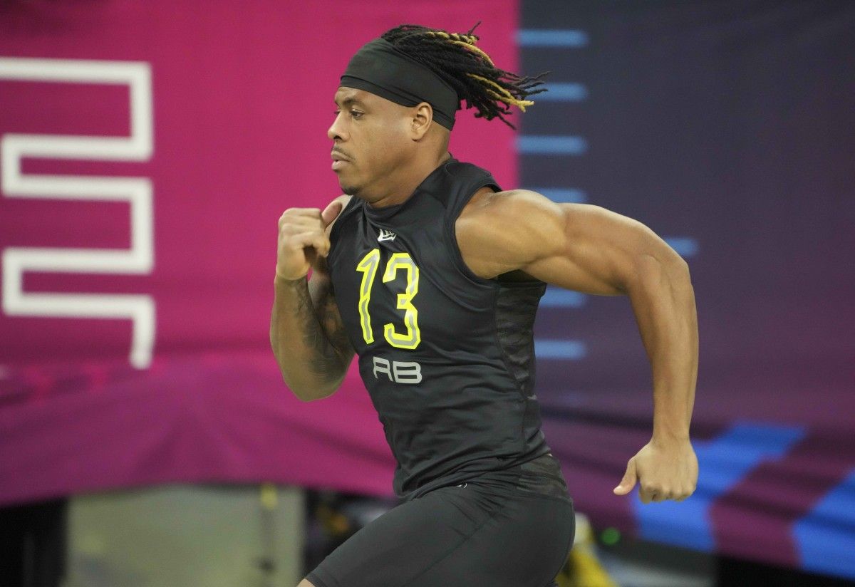 Mississippi running back Jerrion Ealy (RB13) runs the 40-yard dash during the 2022 NFL Scouting Combine at Lucas Oil Stadium.