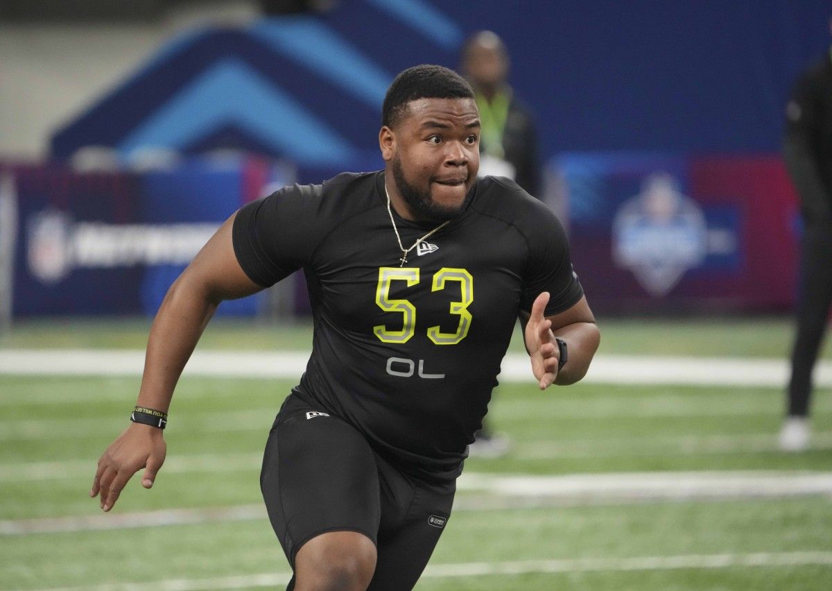 Wake Forest offensive lineman Zach Tom (OL53) goes through drills during the 2022 NFL Scouting Combine at Lucas Oil Stadium.