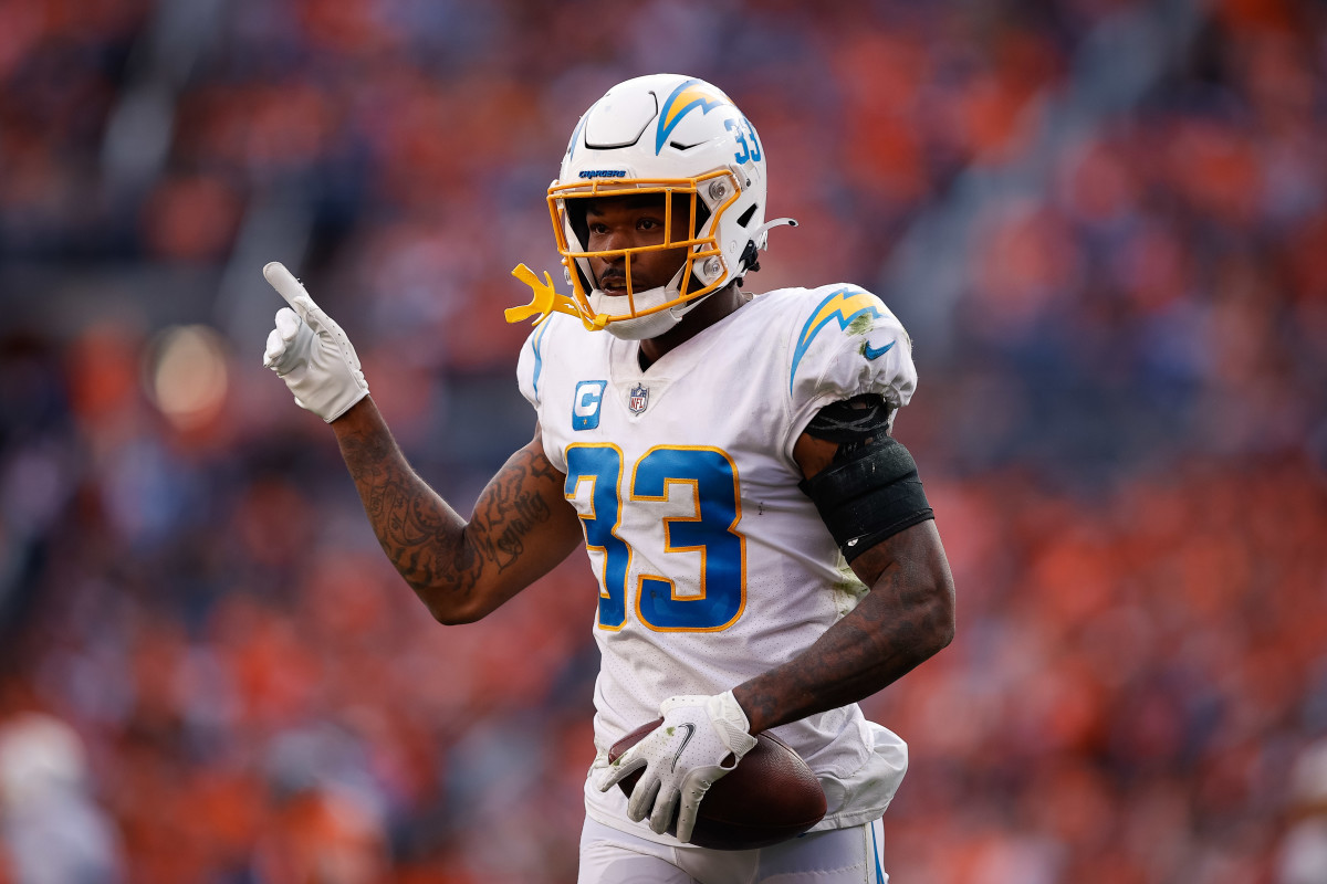Nov 28, 2021; Denver, Colorado, USA; Los Angeles Chargers safety Derwin James Jr. (33) celebrates after an interception in the second quarter against the Denver Broncos at Empower Field at Mile High. Mandatory Credit: Isaiah J. Downing-USA TODAY Sports