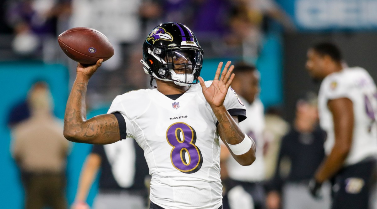 Ravens quarterback Lamar Jackson throws the football prior to a game against the Dolphins.