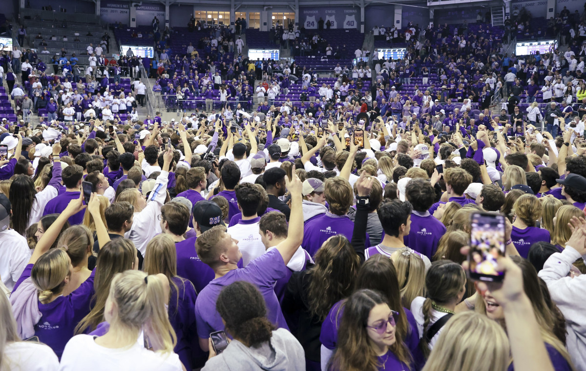 Mar 1, 2022; Fort Worth, Texas, USA; TCU Horned Frogs fans storm the court after the game against the Kansas Jayhawks at Ed and Rae Schollmaier Arena.