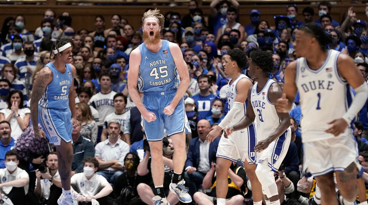 North Carolina forward Brady Manek (45) and forward Armando Bacot (5) react following a play during the second half of the team's NCAA college basketball game against Duke in Durham, N.C., Saturday, March 5, 2022.