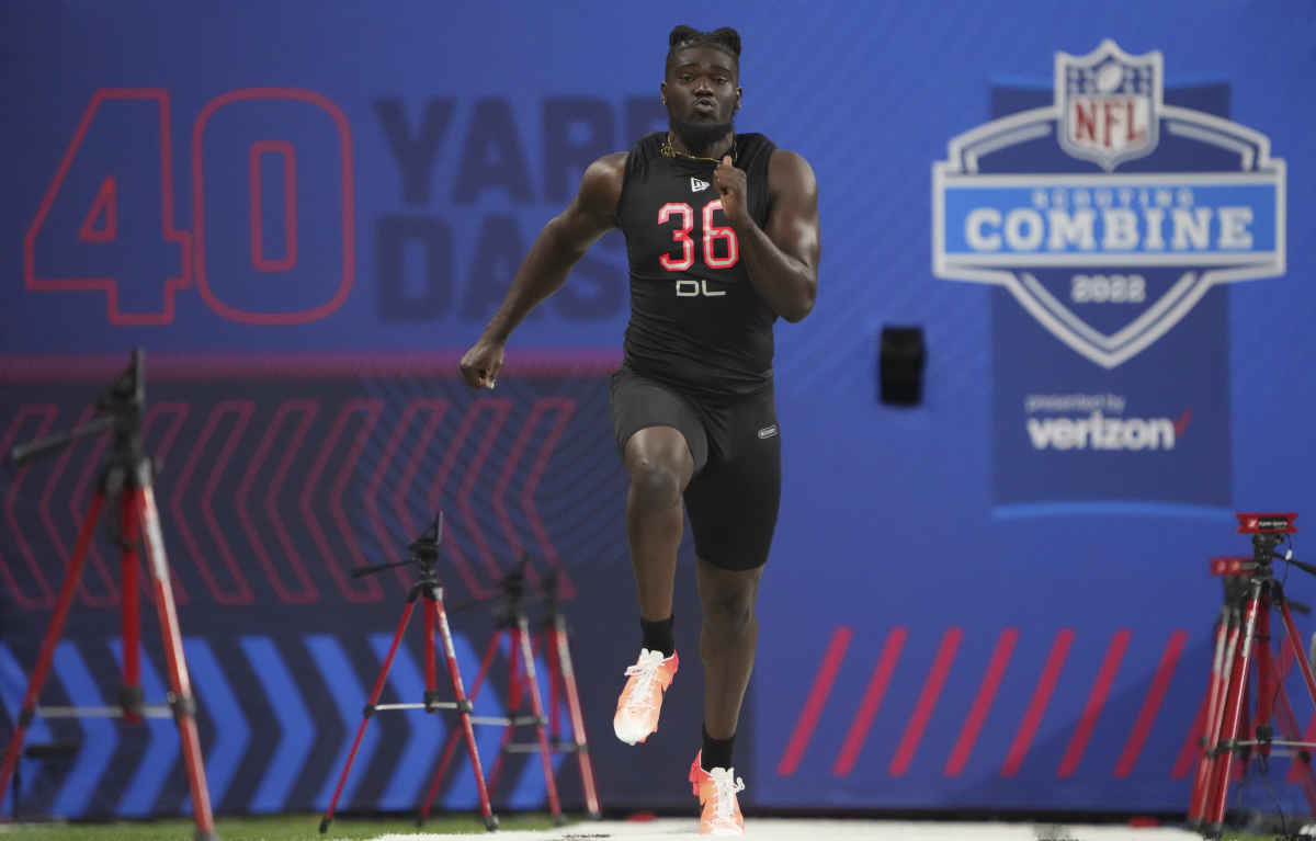 Mar 5, 2022; Indianapolis, IN, USA; Michigan defensive lineman David Ojabo (DL36) runs the 40-yard dash during the 2022 NFL Scouting Combine at Lucas Oil Stadium. Mandatory Credit: Kirby Lee-USA TODAY Sports