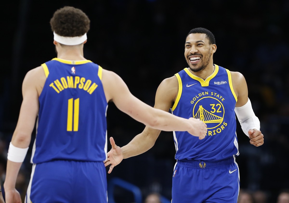 Feb 7, 2022; Oklahoma City, Oklahoma, USA; Golden State Warriors forward Otto Porter Jr. (32) celebrates with guard Klay Thompson (11) after scoring against the Golden State Warriors during the second half at Paycom Center. Golden State won 110-98. Mandatory Credit: Alonzo Adams-USA TODAY Sports