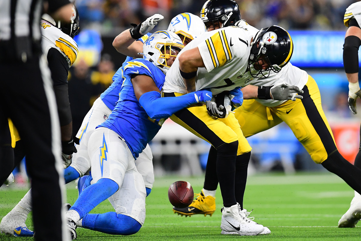 Nov 21, 2021; Inglewood, California, USA; Pittsburgh Steelers quarterback Ben Roethlisberger (7) is brought down by Los Angeles Chargers outside linebacker Uchenna Nwosu (42) during the second half at SoFi Stadium. Mandatory Credit: Gary A. Vasquez-USA TODAY Sports