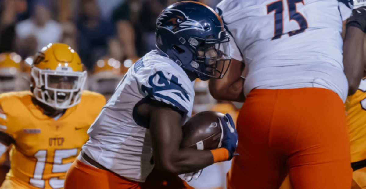 UTSA Roadrunners wide receiver and cornerback Tariq Woolen catches a pass during a college football game.