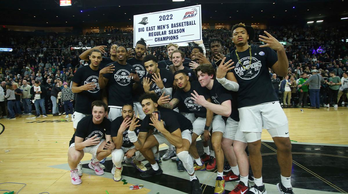 Providence celebrates winning the Big East regular season championship after defeating Creighton in an NCAA college basketball game Saturday, Feb. 26, 2022, in Providence, R.I.