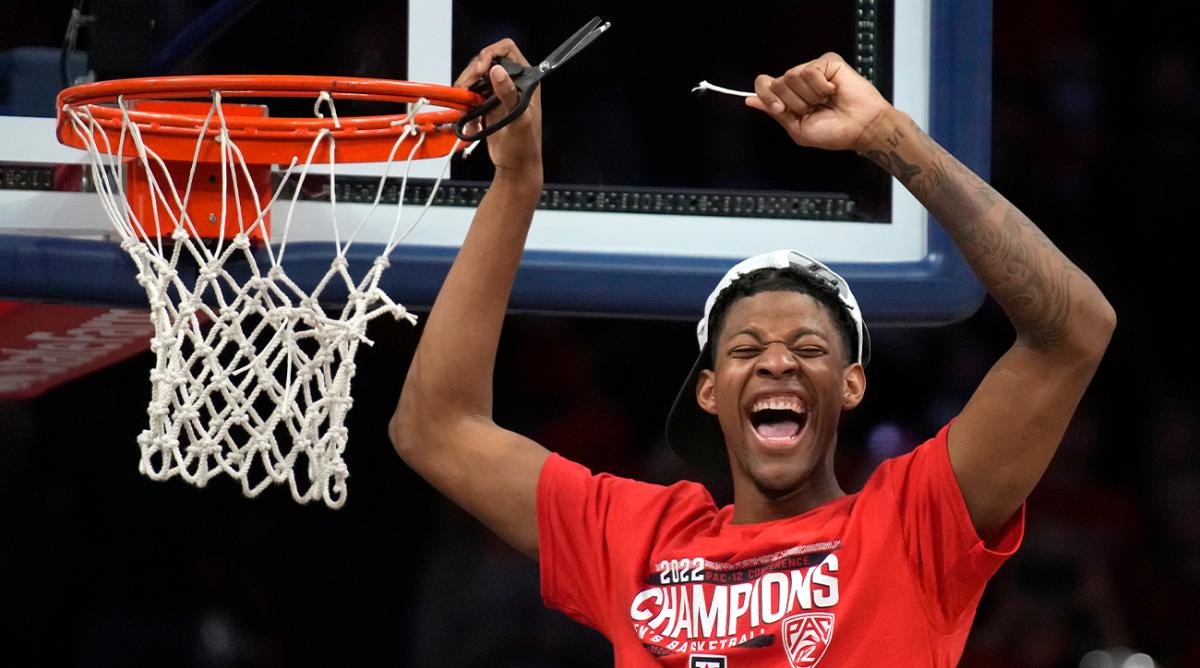 Arizona guard Dalen Terry (4) celebrates while cutting the net after an NCAA college basketball game against California, Saturday, March 5, 2022, in Tucson, Ariz. Arizona won the Pac-12 Conference Championship.